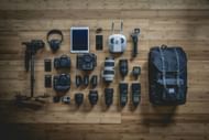 Additional equipment like lens, battery, and tripod are essential (Image via Unsplash/@jeffhopper)